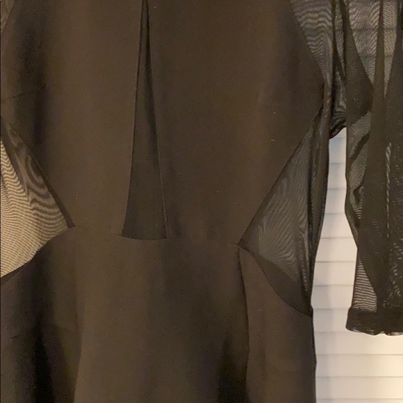Black Sheer Peplum Dress with Chain Detail - Picture 3 of 4